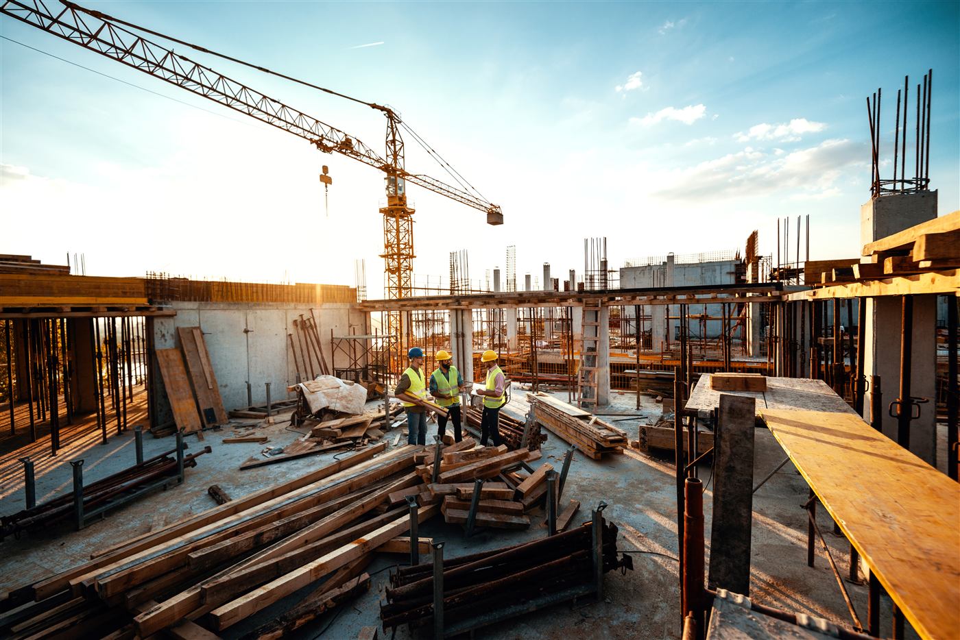 Construction site with crane in evening light